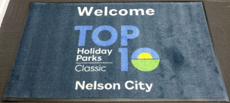 Nelson City Top 10 - prestige logo mat